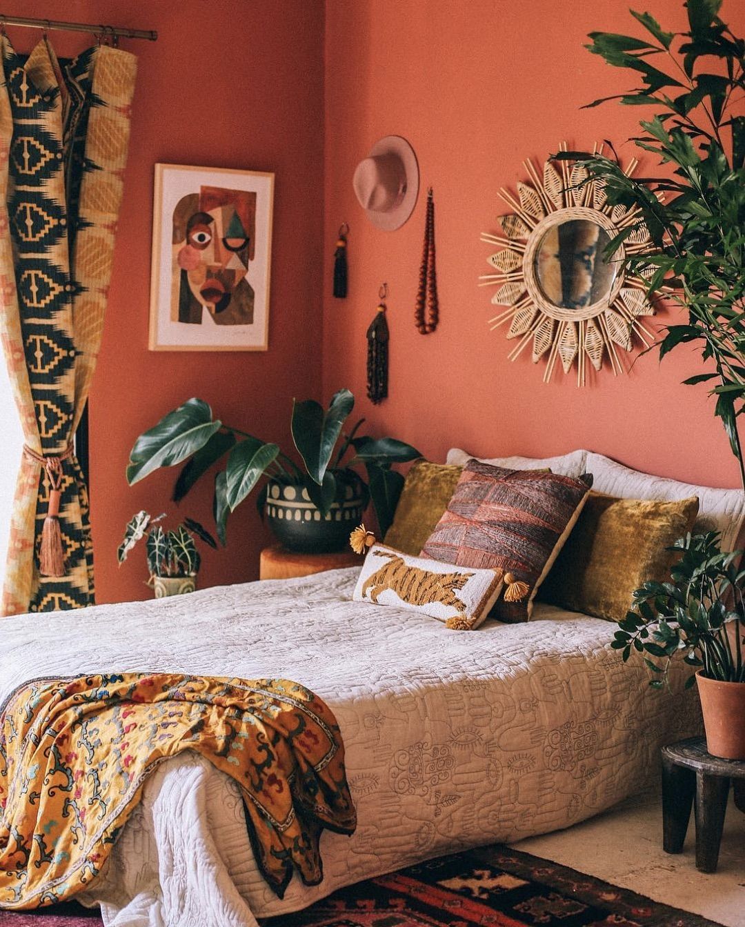 An Energic Bohemian Bedroom with Terracotta Wall