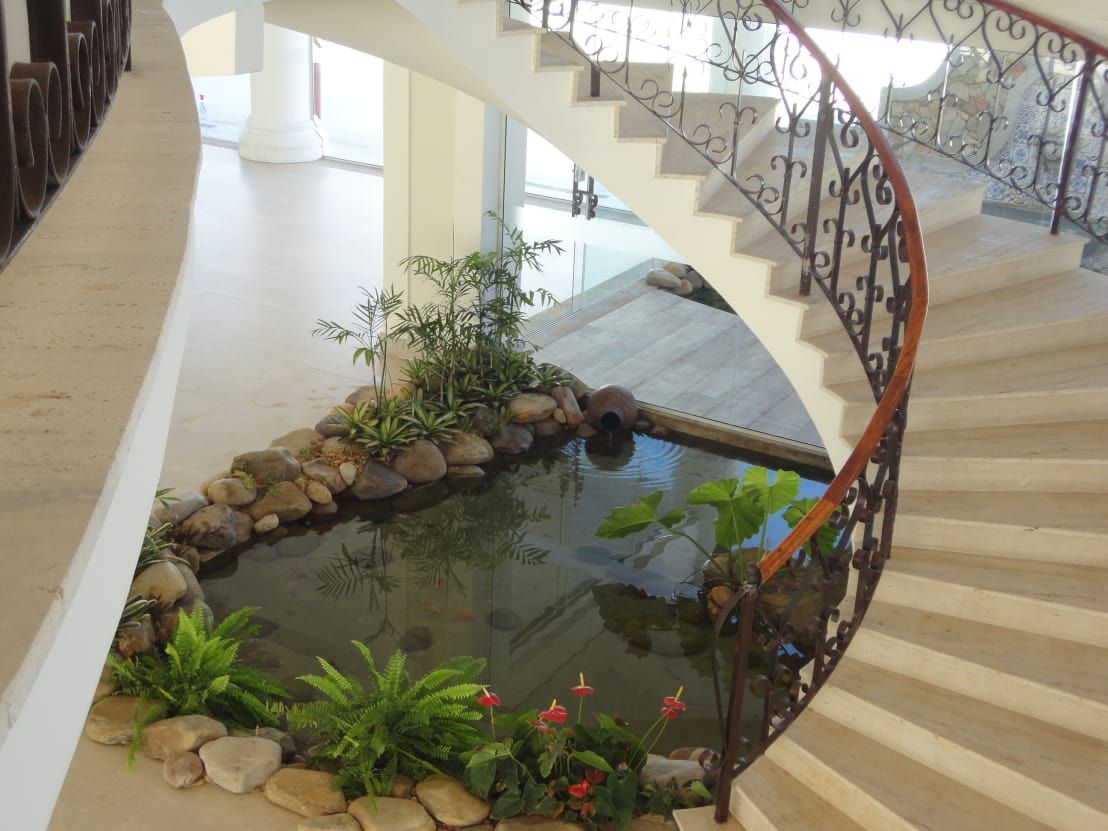 Fish Pond under The Stairs