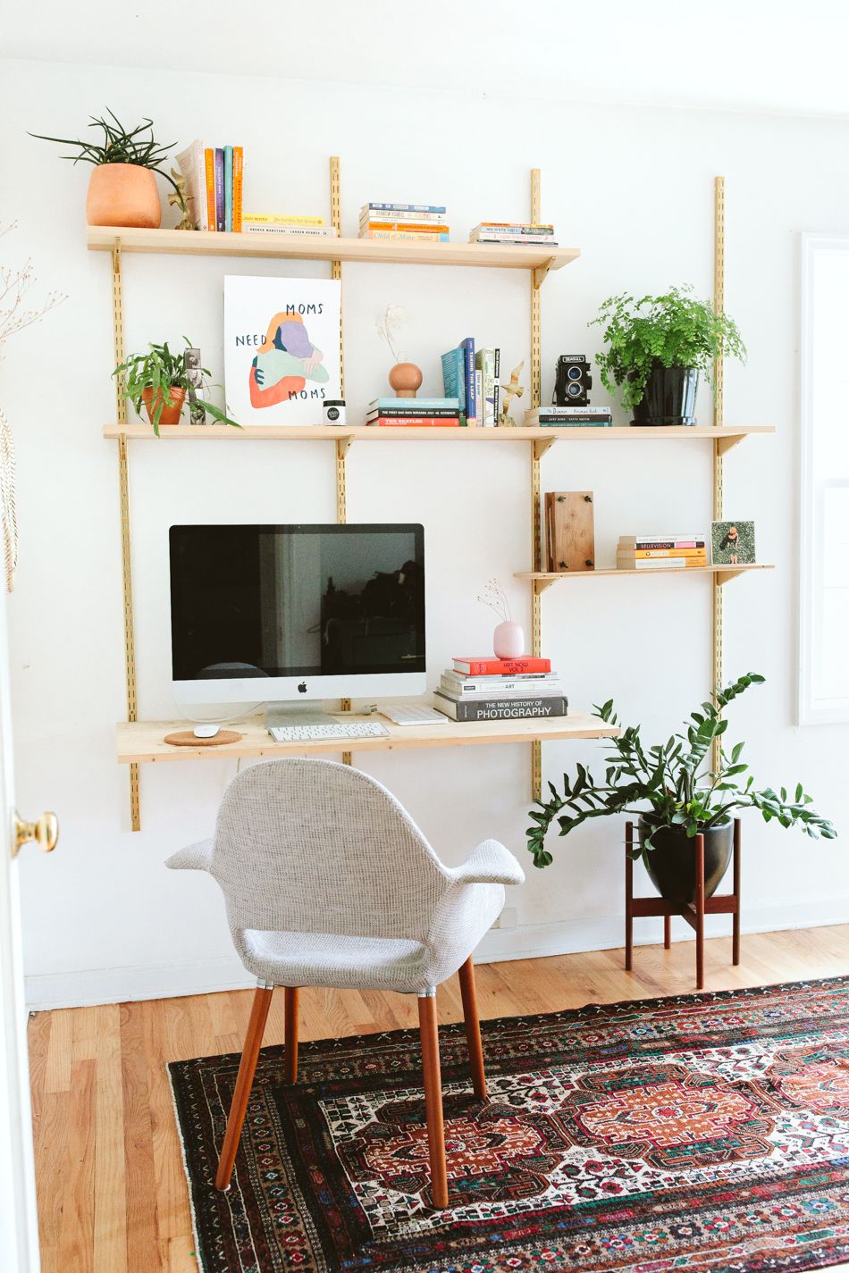 Mid Century Design with An Areal Rug to Mark The Space