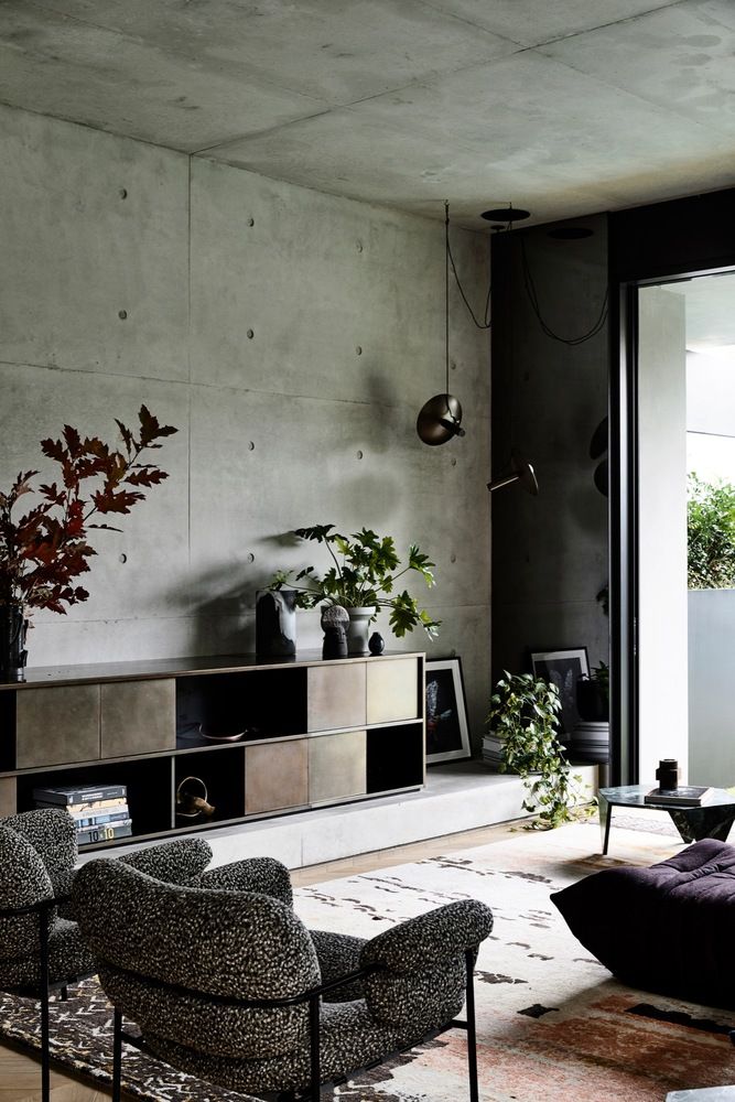 Decorate The Concrete Wall with Some Furniture